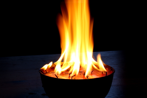 Fire is catching! My birthday candles gone rouge - on the kitchen table.